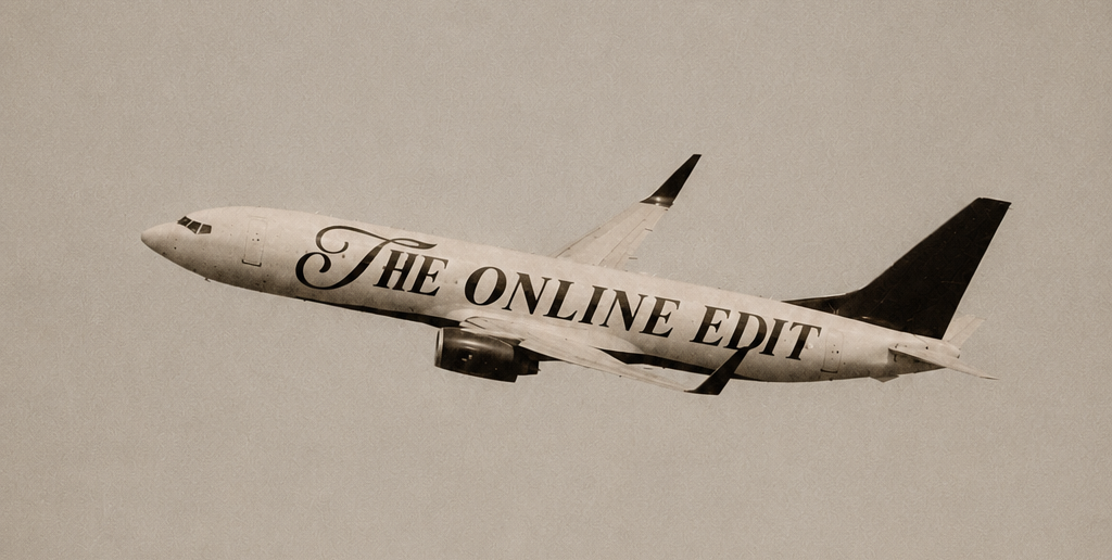 A sepia-toned photograph of a commercial airplane flying across a cloudy sky, with the words 'THE ONLINE EDIT' printed along the side of the fuselage.